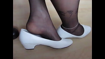 white patent leather pumps and black nylons, shoeplay and dangling by Isabelle-Sandrine