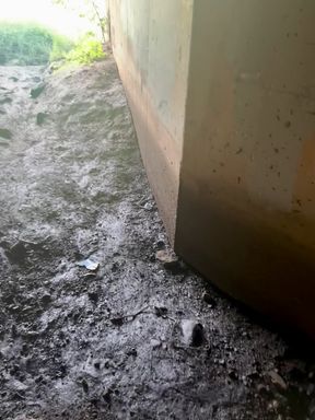 Slim girl takes a risk under the bridge for some alone time