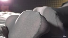 Foot fetish legs in grey opaque tights