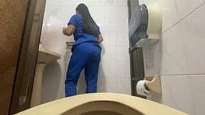 Nurse in public bathroom shows off her soaking pussy