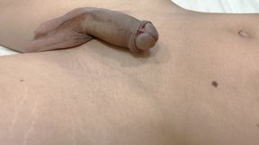 A boy with a large foreskin gets an erection, masturbates, and cums twice