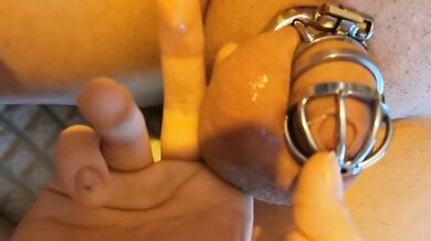 Locked in the cage while they tease me to my happy ending