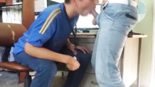 Hot coworker gives a sloppy blowjob to his hunky friend outside the office