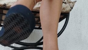 Alicia crosses her legs and lets her flip-flops sway (2)