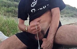 He wanks in the dunes