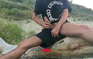 He wanks in the dunes