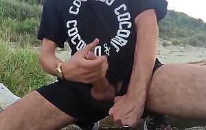 He wanks in the dunes