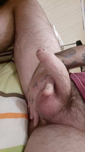 hairy boy masturbates his big cock in front of the mirror