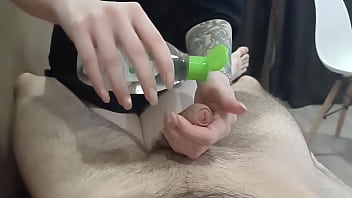 masseuse jerks off cock in oil