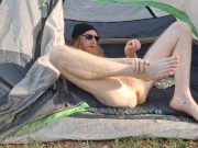 Nude camper oils up and strokes his cock for you while you watch