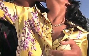 Full clothed black angelica in nude and heels outside