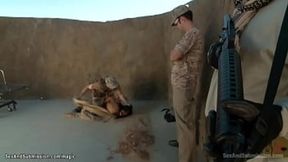 Soldier James Deen binds Lyla Storm and penetrates her in a desert camp, then joins Casey Calvert