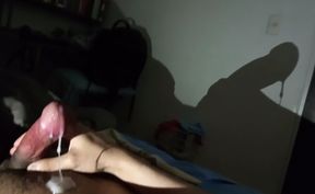 Shadow art in the dark night: reflection of the shadow of my penis and cum against the wall
