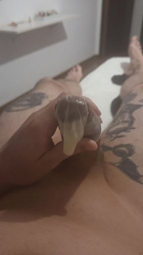 Jerking off and Cum in a Condom