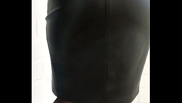 Check out my black shoes, fishnet tights, form-fitting leather skirt, and sexy leather jacket