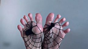 Beautiful feet in fishnets covered cum