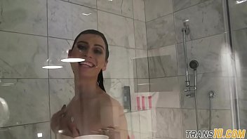 Smalltitted tranny showering while filmed