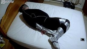 Miss M has a man duct taped on bed in black compression gear