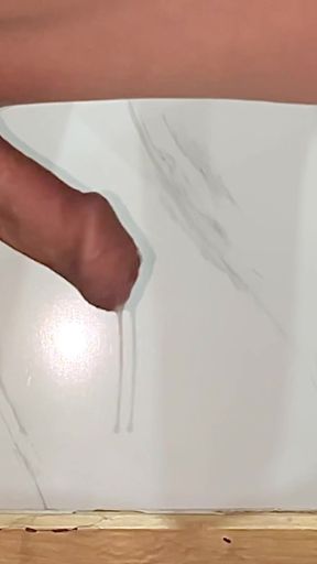 A boy exposes his large, foreskin-covered penis out the window of a high-rise apartment   Clip 1