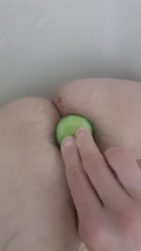 Boy experimenting with cucumber