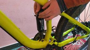 Young man passionately bounces on his petite mountainbike