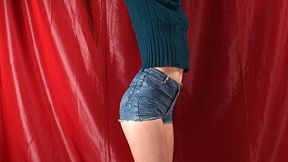 Tapegagged barefoot Mary in green sweater and jeans shorts, bound standing on the floor with her hands tied above to the rack, struggles and wiggles (HD MP4)