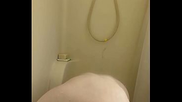 Busty and curvy girl plays with dildo in the shower