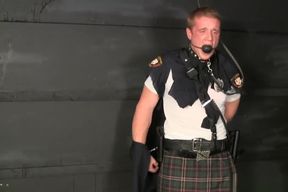 Tall red headed kilted cop bound gagged and stripped.