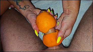 Stepmom makes handjobs with oranges for stepson
