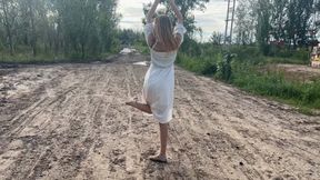 a girl in ballet flats went onto a country road where there is a lot of slippery mud, she slips and her ballet flats are all covered in mud (reupload)