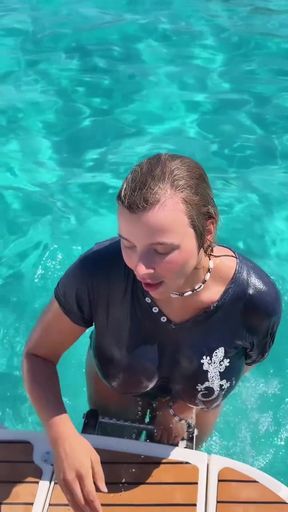 Woman in wetsuit on boat