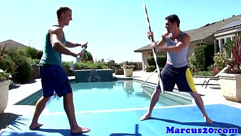 Gay muscular jocks fighting by the pool
