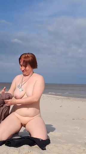 A biker girl strips naked and masturbates on a wild beach.   Clip 1