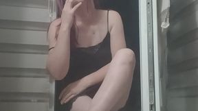 Sexy Redhead with Glasses Smoking on the Balcony
