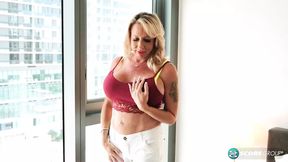 Bella Lexi, ex-cop, cops a feel of her own tits and pussy