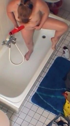 Sexy chubby amateur fucks herself in the bathroom