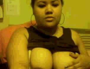 Chubby mulatto chick sucks her fingers and caresses her large titties