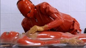 Rubber vac-bed breath play session with two latex piss lesbians - Part 1 of 2