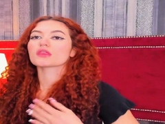 Curly Redhead Shaking While Rubbing Her Pussy