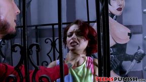 Redhead teenie gets locked up in a cage and fucked hard