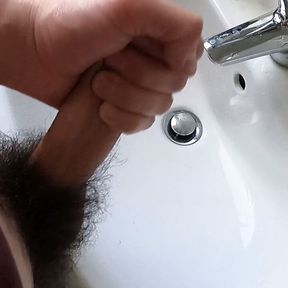 Wanking hairy cock in bathroom and cumming