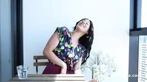 Dark-haired beauty plays with a massive dildo