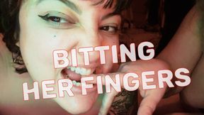 Bitting her fingers