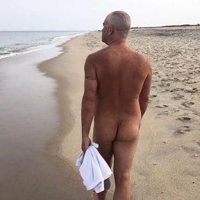 Public nude beach stroll with bending over