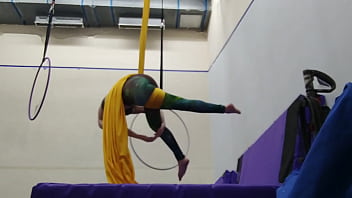 Practicing hip locks on the aerial silks