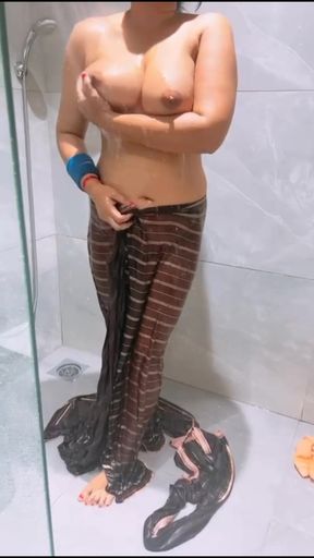 Indian sari-clad milf shows off her big tits in solo tease