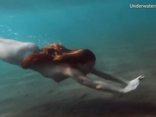 Enjoy a redhead underwater and lesbians