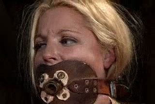 Gagged blonde gets her cute pussy whipped in BDSM scene