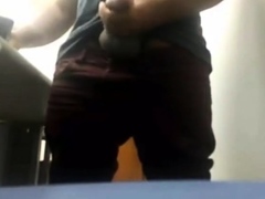 Brazilian Daddy Strokes His Big Uncut Cock at Work