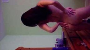 Captivating brunette sexpot with curvy body shakes strips on cam
